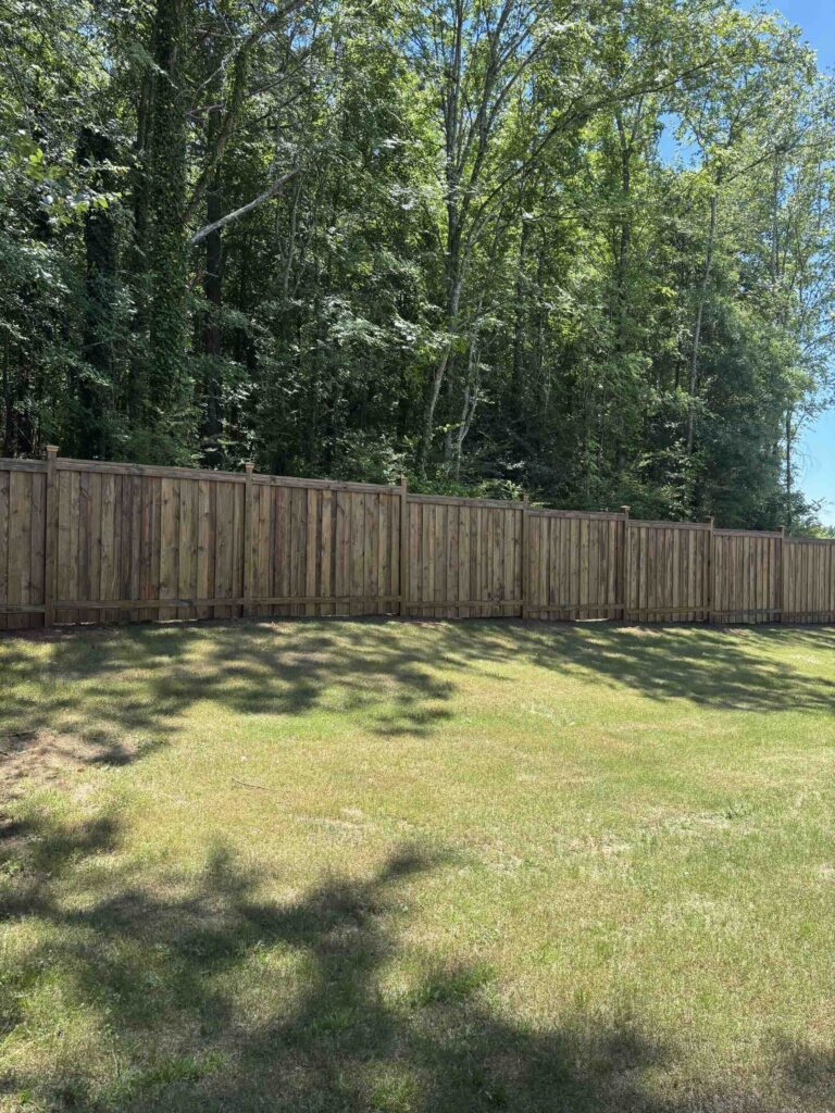 Custom fence in a spacious backyard in Guntersville
