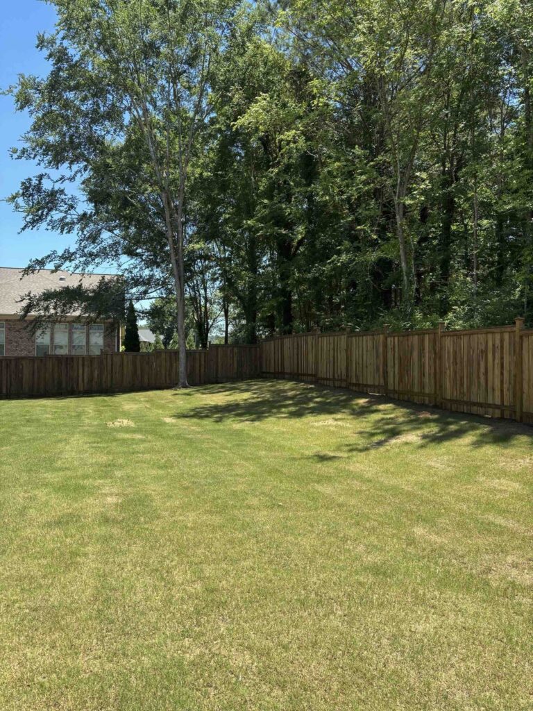 Fenced in backyard built by Longleaf