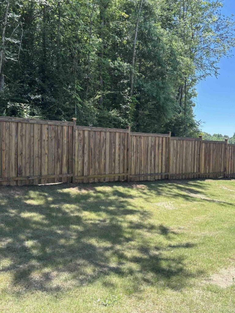 Custom fence in a backyard in Guntersville, AL